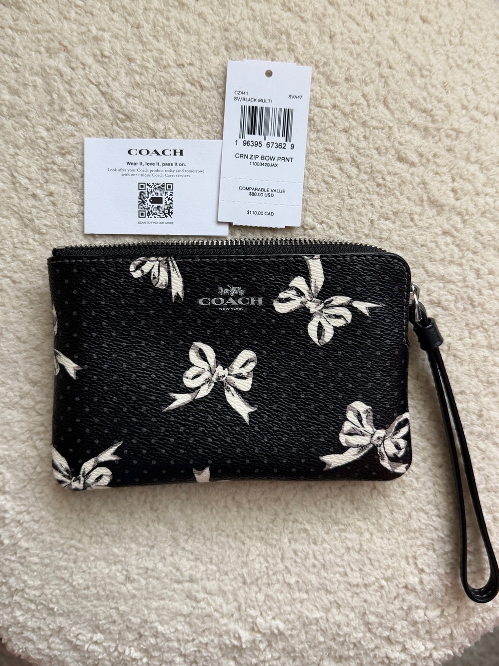 COACH Corner Zip Wristlet With Bow Print